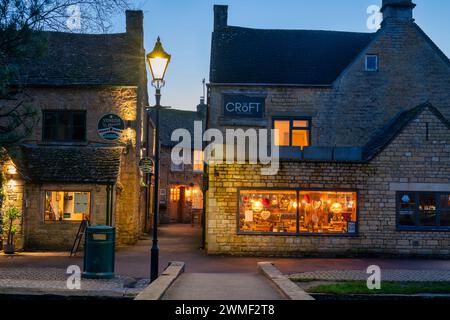 Restaurants at dusk. Bourton on the Water, Cotswolds, Gloucestershire, England Stock Photo