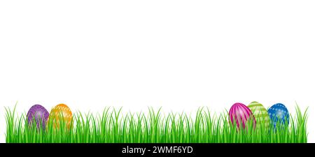 Easter eggs hidden in green grass. Colored Paschal eggs, arranged in a piece of lawn. Symbol for an egg hunt, a treasure hunt played at Easter. Stock Photo