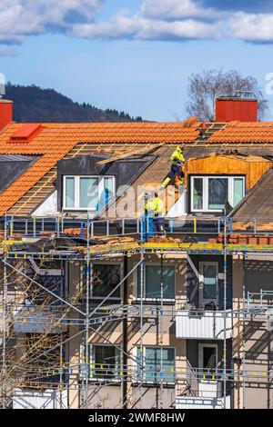 Roof renovation on an apartment building Stock Photo