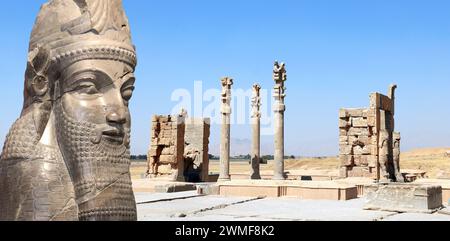 Horizontal banner with Gate of All Nations (Xerxes Gate) and face of assyrian protective deity lamassu - human-headed winged bull, Persepolis, Iran Stock Photo