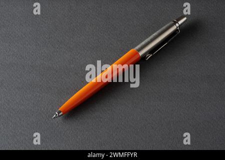 Close up of a vintage style Ballpoint pen on a dark gray background Stock Photo