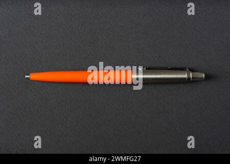 Close up of a vintage style Ballpoint pen on a dark gray background Stock Photo