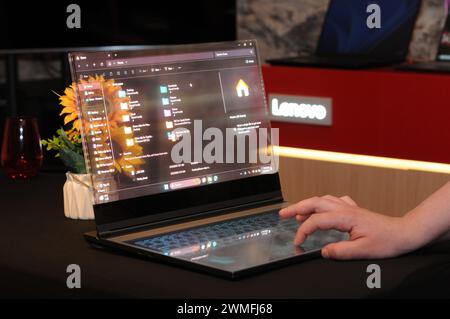 Barcelona, Spain. 24th Feb, 2024. A laptop with a transparent screen stands in a room in Barcelona, where computer manufacturer Lenovo presented new products. It is a prototype (proof of concept) - whether it will ever come onto the market is still unclear. The Hong Kong-based company is presenting new products and the transparent prototype at the Mobile World Congress (MWC) trade fair. Credit: Wolf von Dewitz/dpa/Alamy Live News Stock Photo