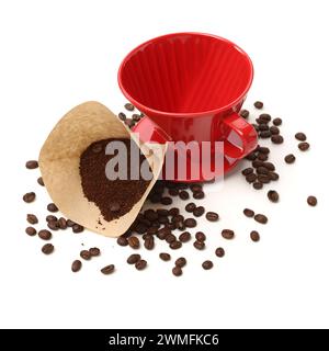 Coffee cone with filter paper full of coffee on white background Stock Photo