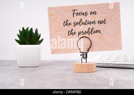 Paper note with text focus on the solutions not the problem Stock Photo