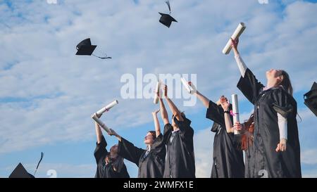 Graduation Caps Thrown in the Air. Stock Photo