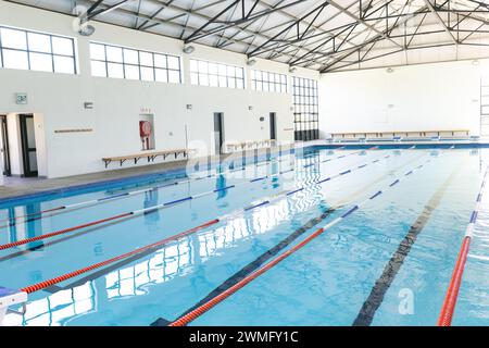 An indoor swimming pool awaits swimmers, with copy space Stock Photo