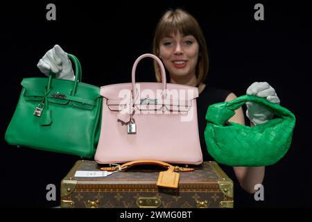 Bonhams, Knightsbridge, London, UK. 26th Feb, 2024. Bonhams Knightsbridge hosts the first Designer Handbags and Fashion sale of 2024. The live sale takes place on 28 February. Highlights include (centre): Hermès: Rose Sakura Swift Leather Birkin 25, 2023 (includes accessories), estimate £18,000-22,000; (left) Hermès: Bambou Swift Leather Birkin 25, estimate £12,000-18,000; (right) Bottega Veneta: Parakeet Green Lambskin Mini Jodie, estimate £700-900. Credit: Malcolm Park/Alamy Live News Stock Photo