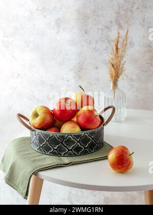 ripe red apples on the table Stock Photo