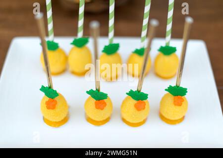 Pineapple Cake Pops on a Wooden Table Stock Photo
