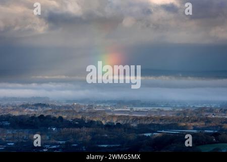 Brighton, February 25th 2024: A rare rainbow ball in the sky above the Weald of Sussex, seen from Devil's Dyke, in the South Downs National Park at su Stock Photo