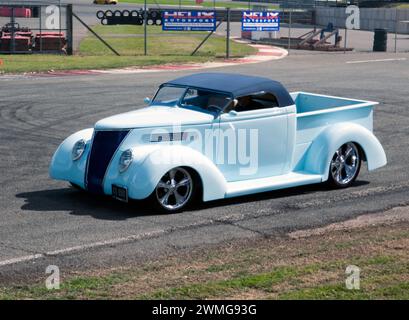 View of a White,  1937 Ford-Based Customized Hot Rod, being demonstrated in the Yokahama Shift and Drift Zone, of the 2023 Silverstone Festival Stock Photo
