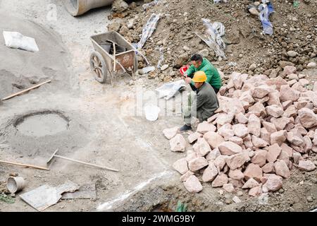 Resting worker at construction site Stock Photo