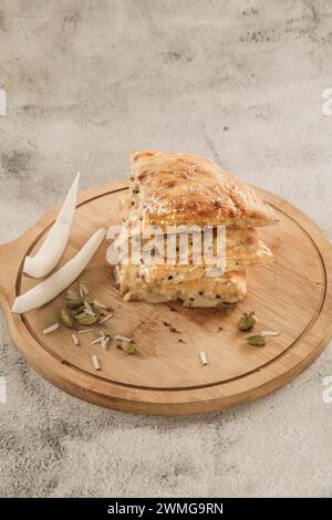 Sweet rabri stuffed naan, made in condensed milk with coconut toppings pistachio and cardamom. Stock Photo