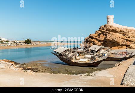Landscape of the bay of Sur with the fort on the rock, Sultanate of Oman in the Middle East. Stock Photo
