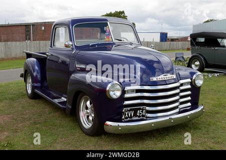 Three-quarters front view of a Purple, 1949,  Chevrolet 3100 Hot Rod, on display in the Yokohama Shift and Drift Zone of the 2023 Silverstone Festival Stock Photo