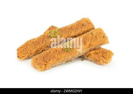 Turkish dessert kadayif isolated on white background, Shredded dough baked in syrup topped with crushed pistachios, Turkish delight Stock Photo