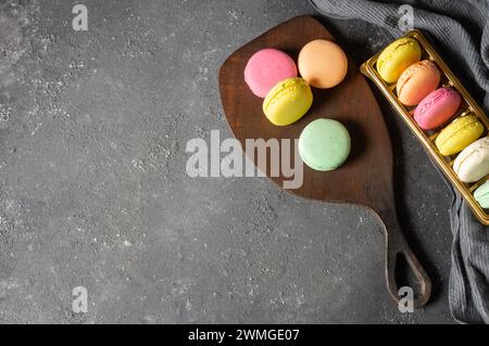 French dessert colorful macarons on rustic background Stock Photo