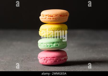 French dessert colorful macarons on rustic background Stock Photo