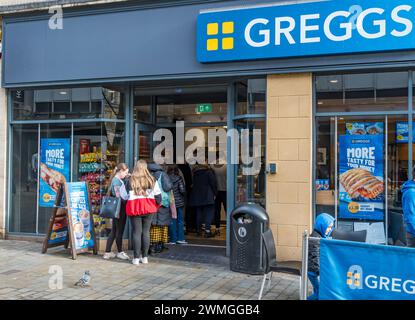 Lunch time queue for refreshments at Greggs, High Street, Lincoln City, Lincolnshire, England, UK Stock Photo