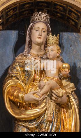 BELLANO, ITALY - JULY 20, 2022: The detail of carved polychrome statue of Madonna in the church Chiesa dei santi Nazareo e Celso by unknown artist Stock Photo