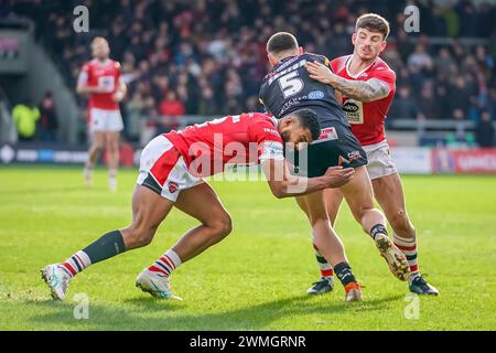 KALLUM WATKINS and AMIR BOUROUH making a tackle. Salford Red Devils Vs Castleford Tigers Betfred Super League Round 2, Salford Community Stadium, 25th February 2024. Credit: James Giblin/Alamy Live News. Stock Photo