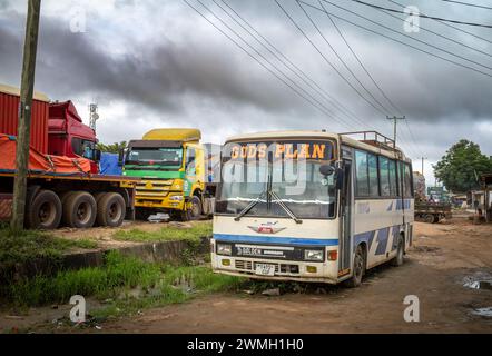 A bus with 'Gods Plan' on the windscreen at a truck stop on the main A7 east-west highway from Dar es Salaam in Tanzania. Stock Photo