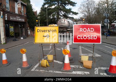 Chalfont St Peter, UK. 26th February, 2024. Part of the village of Chalfont St Peter remains closed to vehicles as Thames Water and their contractors are continuing to pump up groundwater and sewage from manholes in the village of Chalfont St Peter in Buckinghamshire. Thames Water have reportedly been there since 2nd January, 2024. Thames Water have been pumping sewage directly into the River Misbourne, a precious chalk stream. The stream has sewage floating in it including dirty toilet paper. Part of the road also has sewage on it. The ongoing sewage scandal is having a very detrimental impac Stock Photo