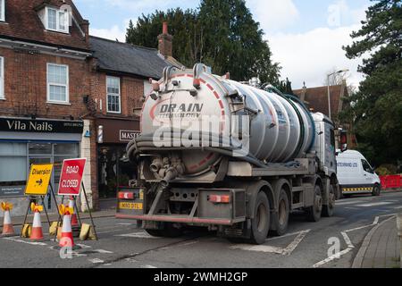 Chalfont St Peter, UK. 26th February, 2024. Part of the village of Chalfont St Peter remains closed to vehicles as Thames Water and their contractors are continuing to pump up groundwater and sewage from manholes in the village of Chalfont St Peter in Buckinghamshire. Thames Water have reportedly been there since 2nd January, 2024. Thames Water have been pumping sewage directly into the River Misbourne, a precious chalk stream. The stream has sewage floating in it including dirty toilet paper. Part of the road also has sewage on it. The ongoing sewage scandal is having a very detrimental impac Stock Photo