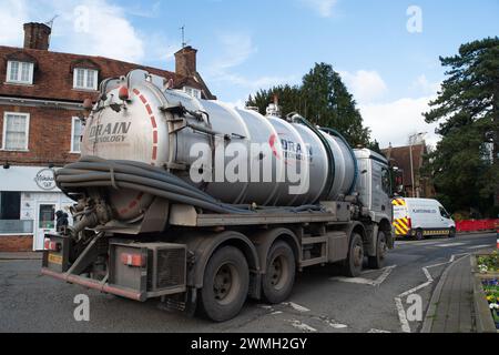 Chalfont St Peter, UK. 26th February, 2024. Part of the village of Chalfont St Peter remains closed to vehicles as Thames Water and their contractors are continuing to pump up groundwater and sewage from manholes in the village of Chalfont St Peter in Buckinghamshire. Thames Water have reportedly been there since 2nd January, 2024. Thames Water have been pumping sewage directly into the River Misbourne, a precious chalk stream. The stream has sewage floating in it including dirty toilet paper. Part of the road also has sewage on it. The ongoing sewage scandal is having a very detrimental impac Stock Photo