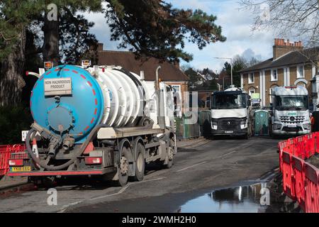 Chalfont St Peter, UK. 26th February, 2024. Part of the village of Chalfont St Peter remains closed to vehicles as Thames Water and their contractors are continuing to pump up groundwater and sewage from manholes in the village of Chalfont St Peter in Buckinghamshire. Thames Water have reportedly been there since 2nd January, 2024. Thames Water have been pumping sewage directly into the River Misbourne, a precious chalk stream. The stream has sewage floating in it including dirty toilet paper. Part of the road also has sewage on it. The ongoing sewage scandal is having a very detrimental impac Stock Photo