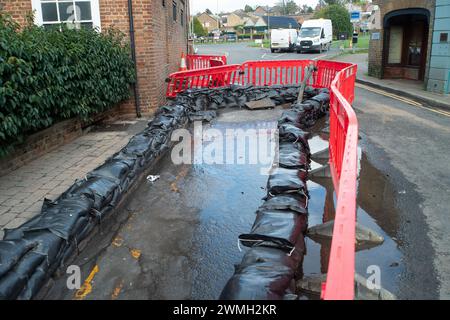 Chalfont St Peter, UK. 26th February, 2024. Sewage on the road. Part of the village of Chalfont St Peter remains closed to vehicles as Thames Water and their contractors are continuing to pump up groundwater and sewage from manholes in the village of Chalfont St Peter in Buckinghamshire. Thames Water have reportedly been there since 2nd January, 2024. Thames Water have been pumping sewage directly into the River Misbourne, a precious chalk stream. The stream has sewage floating in it including dirty toilet paper. Part of the road also has sewage on it. The ongoing sewage scandal is having a ve Stock Photo