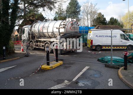 Chalfont St Peter, UK. 26th February, 2024. Part of the village of Chalfont St Peter remains closed to vehicles as Thames Water and their contractors are continuing to pump up groundwater and sewage from manholes in the village of Chalfont St Peter in Buckinghamshire. Thames Water have reportedly been there since 2nd January, 2024. Thames Water have been pumping sewage directly into the River Misbourne, a precious chalk stream. The stream has sewage floating in it including dirty toilet paper. Part of the road also has sewage on it. The ongoing sewage scandal is having a very detrimental impac Stock Photo