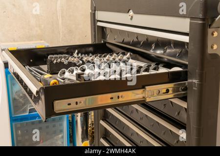 Took cart with one open drawer and lots of wrenches on display. Stock Photo