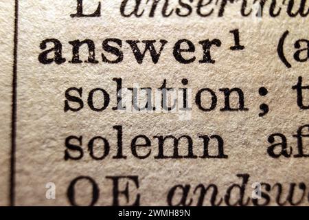 Definition of words answer and solution on dictionary page, close-up Stock Photo