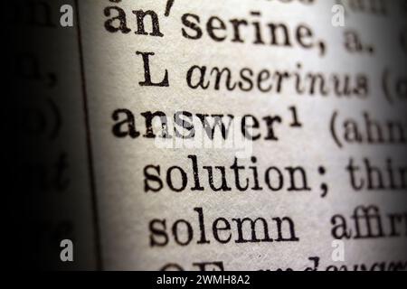 Definition of word answer on dictionary page, close-up Stock Photo
