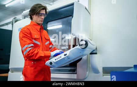 Mechanical engineer using coordinate measuring machine CMM measurement technologies at production line in the industry factory. Stock Photo