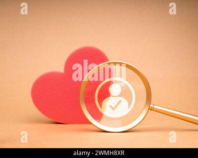 Love match, couple finding, matching partners online concept. Human icon with checkmark symbol, right person, in gold magnifying glass looking on red Stock Photo