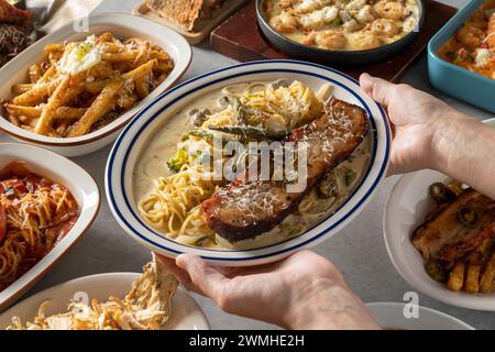 Spicy cream shrimp fondue Korean food dish meal Brick Pasta Rosé Cream Shrimp Tteokbokki Mac and Cheese Potatoes Tomato Meatlover Pasta Stock Photo