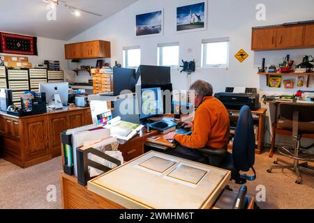Photographer working at computere in studio - office; Salida; Colorado; USA Stock Photo