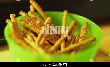 Close-up of pretzels in a green bowl on a table Stock Photo