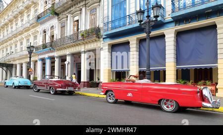 017 Old blue-pink-black almendron cars -yank tank, Ford and Chevrolet American classics from 1947-52-53- on Paseo del Prado promenade. Havana-Cuba. Stock Photo