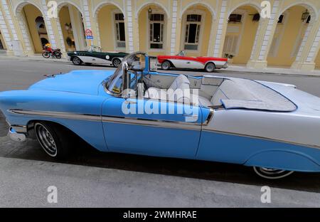 025 Classic blue-white, green-white, red-white American cars -almendron, yank tank, 1956-57 Chevrolet-Buick- parked on Calle Progeso St. Havana-Cuba. Stock Photo