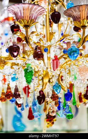 Colorful crystal or glass pendants chandelier or lamp from the world-famous Murano glass. Traditional venetian glass chandelier in branded gift shop, Stock Photo