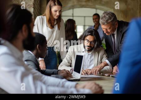 Diverse corporate team strategizing - Collaborative meeting - Innovation, teamwork, planning, creative workspace. Stock Photo