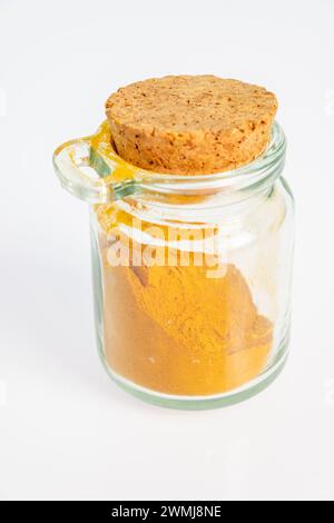 ground turmeric in a glass jar Stock Photo