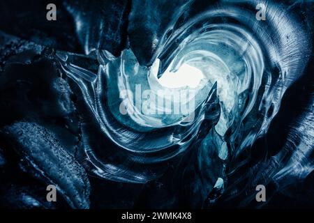 Impressive ice structures, big blue frozen rocks of frigid structure in Vatnajokull caves. Ice tunnels in arctic region wiped out due to climate change, frosty transparent glaciers. Stock Photo