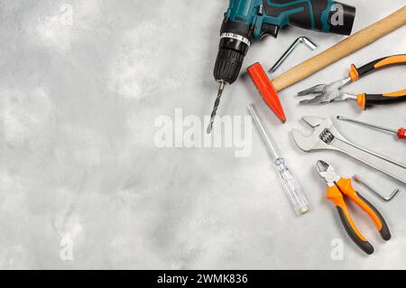 Various repair tools, hardware materials, drill, hammer, pliers, screwdriver, wrench Stock Photo