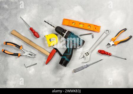 Various repair tools, hardware materials, drill, hammer, pliers, screwdriver, wrench Stock Photo