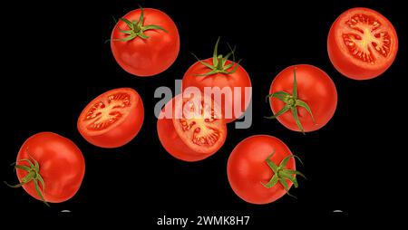 Falling cherry tomatoes on black background Stock Photo
